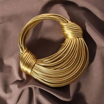 Handwoven noodle bags, rope-knotted hobo, and silver evening clutch / Luxury Designer Handbags for Women in Gold.