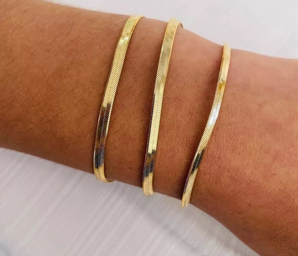Trending Elegance: Women's Classic Snake Chain Bracelet in Gold Color, available in widths of 3/4/5MM. Crafted from Stainless Steel, this bracelet is a timeless and stylish jewelry gift for women.