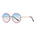 Sunglasses with pink embellishments on a white background