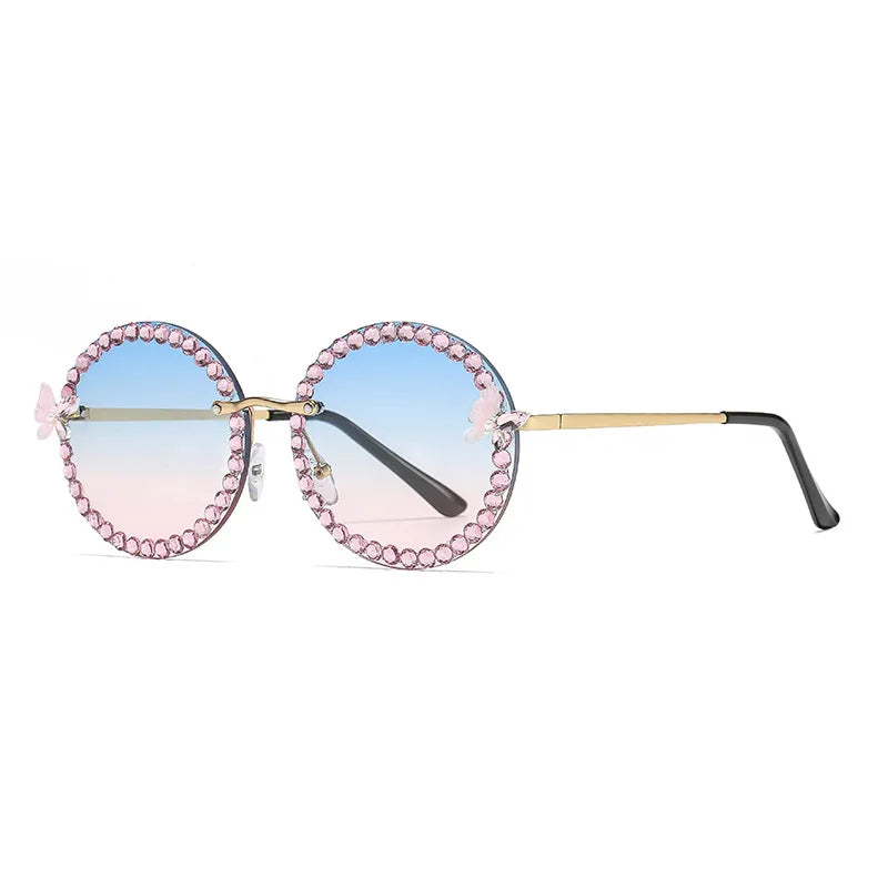Sunglasses with pink embellishments on a white background