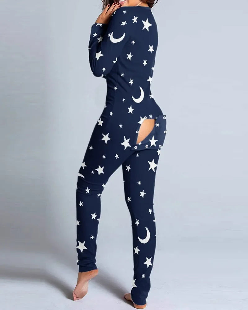 Blue cozy sexy pyjama jumpsuit for women with buttoned front back flap and christmas pattern on a light background