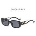 Black sunglasses with gold accents on a white background