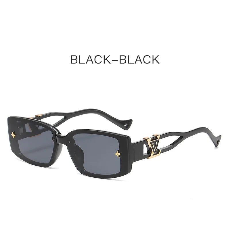 Black sunglasses with gold accents on a white background