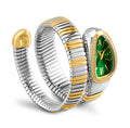 A gold and silver scalable bracelet with bling diamonds, featuring a snake-shaped watch case with a green dial and silver hands.