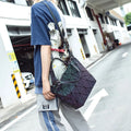 Woman with a chic luminous reflective bao Bag Geometric Tote across her shoulder in a parking environment