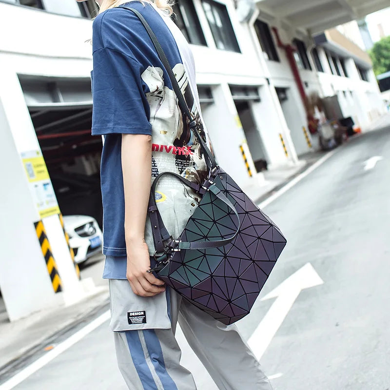 Woman with a chic luminous reflective bao Bag Geometric Tote across her shoulder in a parking environment