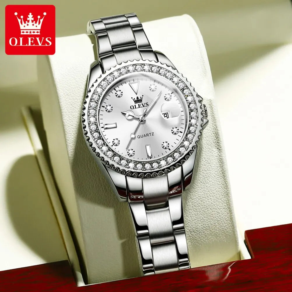 Classy Women’s Diamond dial quartz watch with white face, stainless steel bracelet, crystal bezel, date display on a box and elegant polished finish