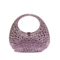 Purple handbag with gemstone embellishments on a white background