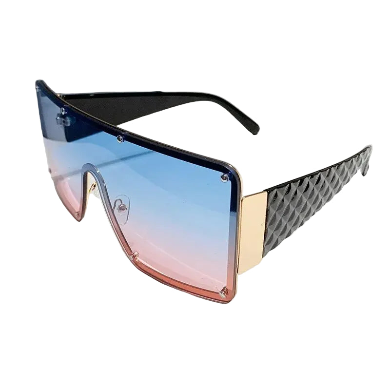 Sunglasses with gradient blue to pink lenses and geometric frame design on a white background
