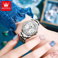 Elegant women’s waterproof diamond dial watch with stainless steel bracelet, crystal bezel, and luxury style worn on wrist