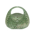 Green handbag with rhinestone embellishments on a white background