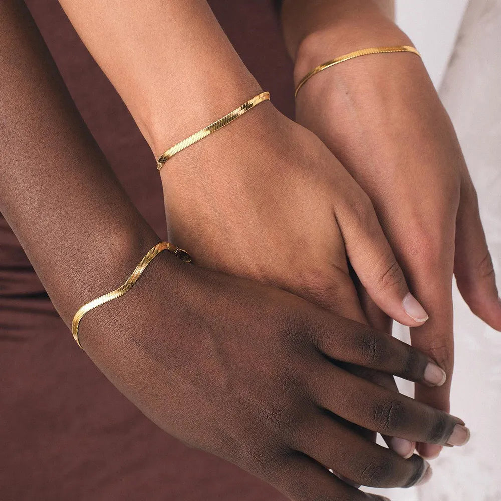 Trending Elegance: Women's Classic Snake Chain Bracelet in Gold Color, available in widths of 3/4/5MM. Crafted from Stainless Steel, this bracelet is a timeless and stylish jewelry gift for women.