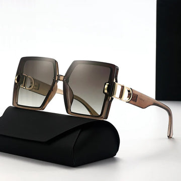 Sunglasses with gold accents on a black case against a white background