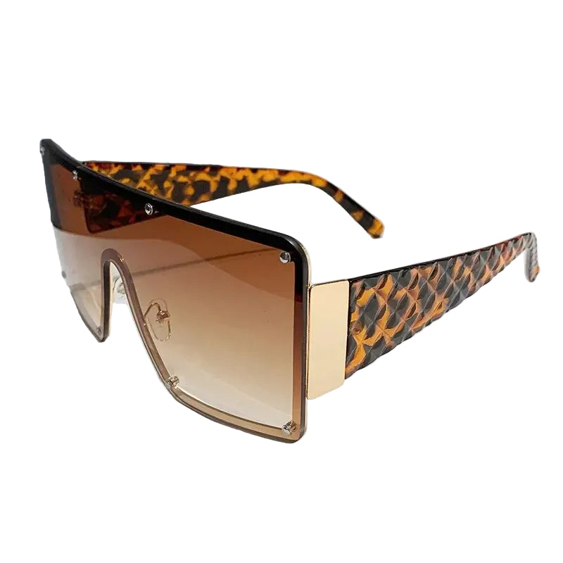 Sunglasses with leopard print arms and gradient lens on a white background