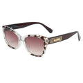 Sunglasses with tortoiseshell frame and gradient lenses on a white background