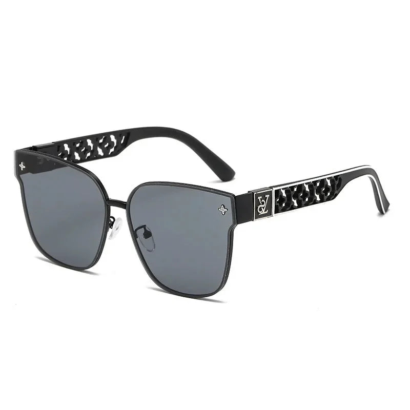 Black sunglasses with decorative arms on a white background