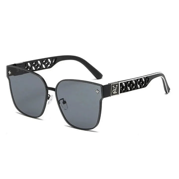 Black sunglasses with decorative arms on a white background