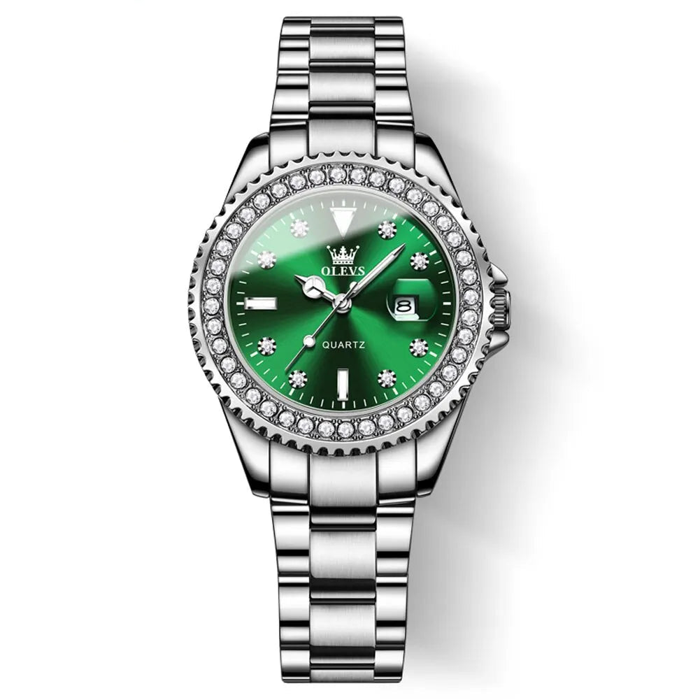 Luxury inspired women’s diamond dial watch with green face, stainless steel bracelet, crystal bezel, date display, and waterproof steel design on a white background