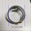 Luxury inspired snake watch for women with bling finish, flexible silver bracelet design, adjustable fit, and elegant wrap style wrist accessory