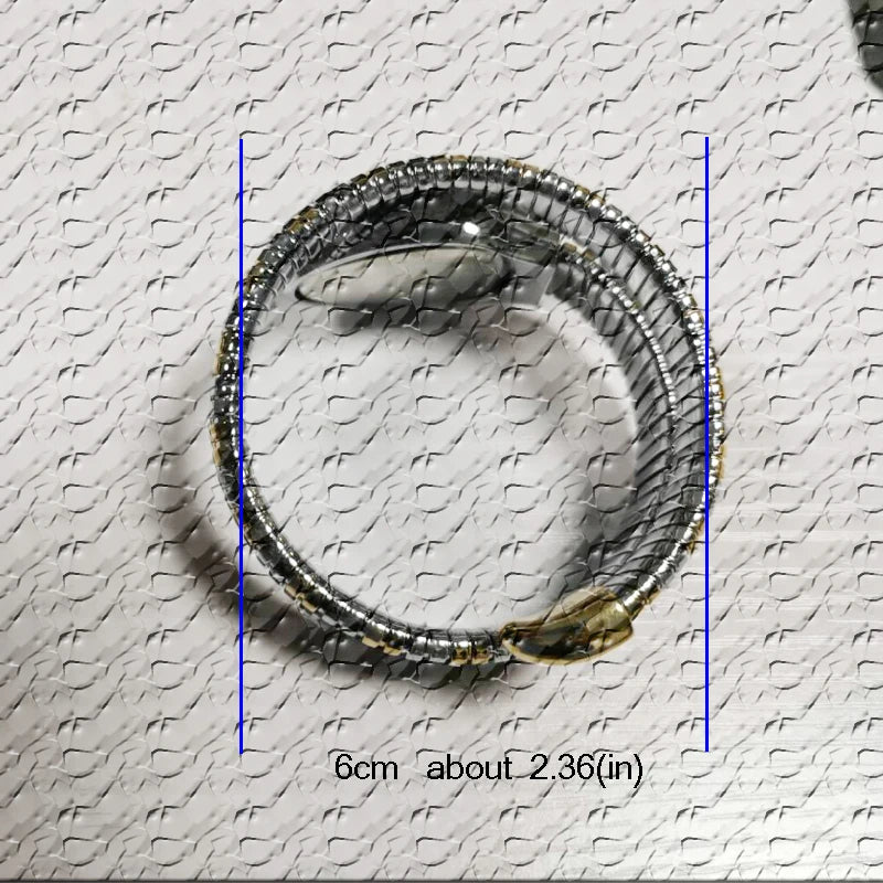 Luxury inspired snake watch for women with bling finish, flexible silver bracelet design, adjustable fit, and elegant wrap style wrist accessory