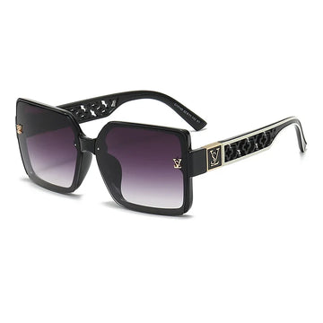 Luxury sunglasses with black frame and gradient lenses on a white background