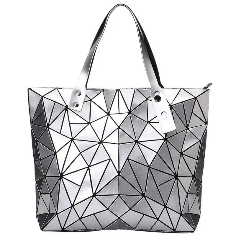 A gold-colored, geometric patterned handbag for women with two handles and a zipper closure.