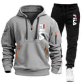 Gray hoodie and black pants with Fila logo on a white background