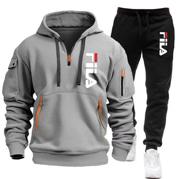 Gray hoodie and black pants with Fila logo on a white background