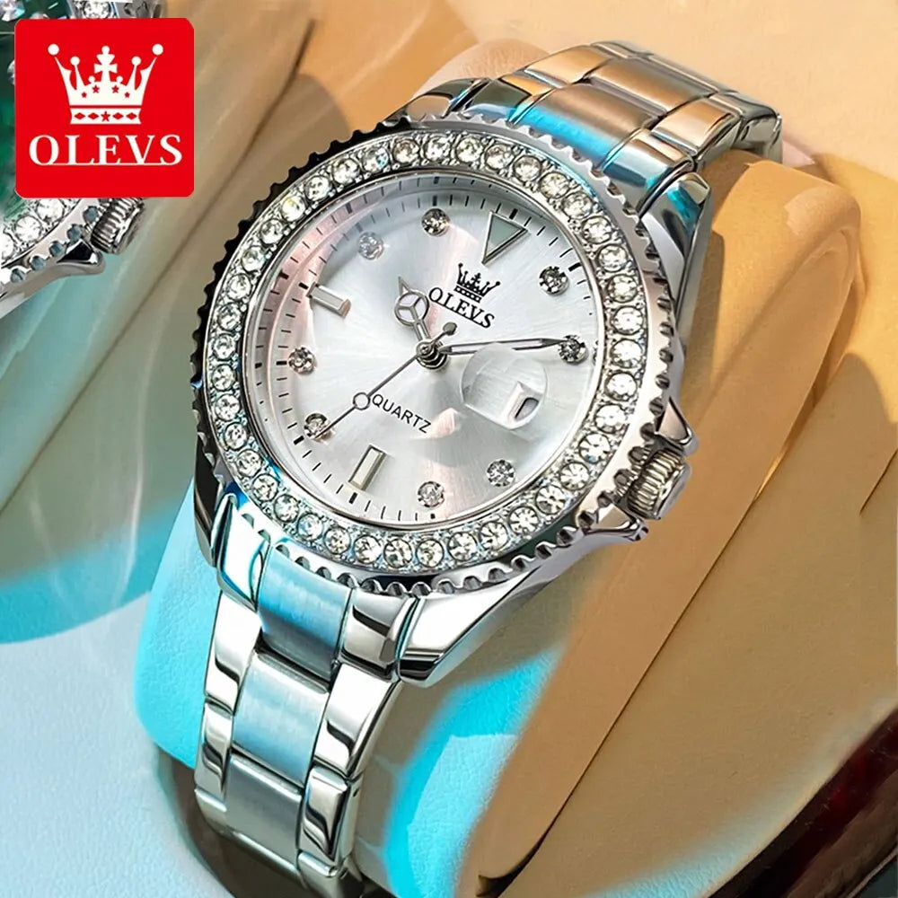 A wristwatch with a diamond-encrusted dial and a stainless steel band, displayed on a glass stand.