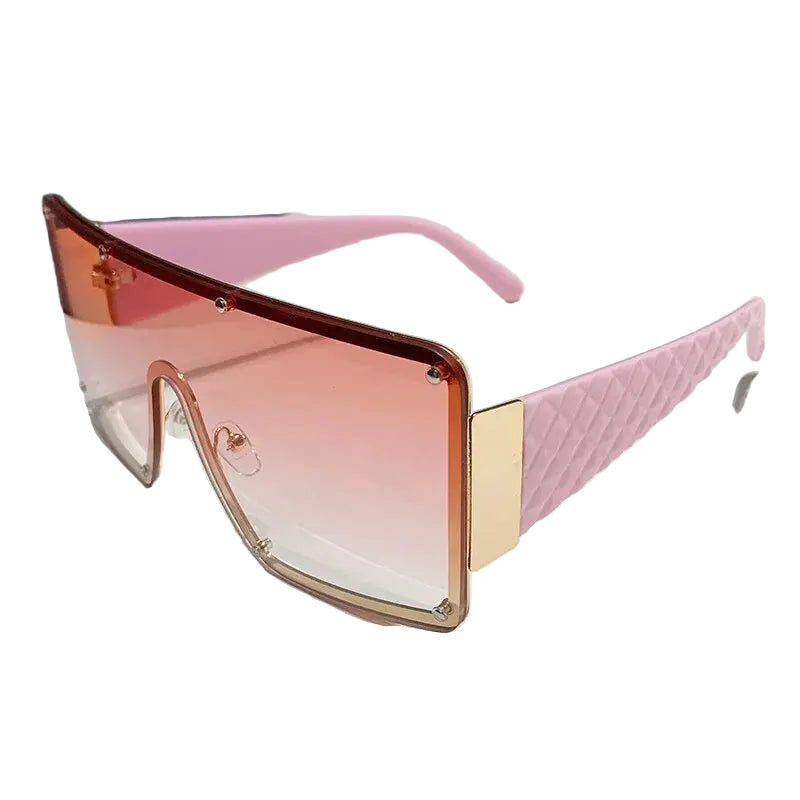 Sunglasses with pink and gold frame on a white background