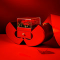 Red jewelry box with a heart design on a red background