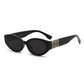 Black sunglasses with gold accents on a white background