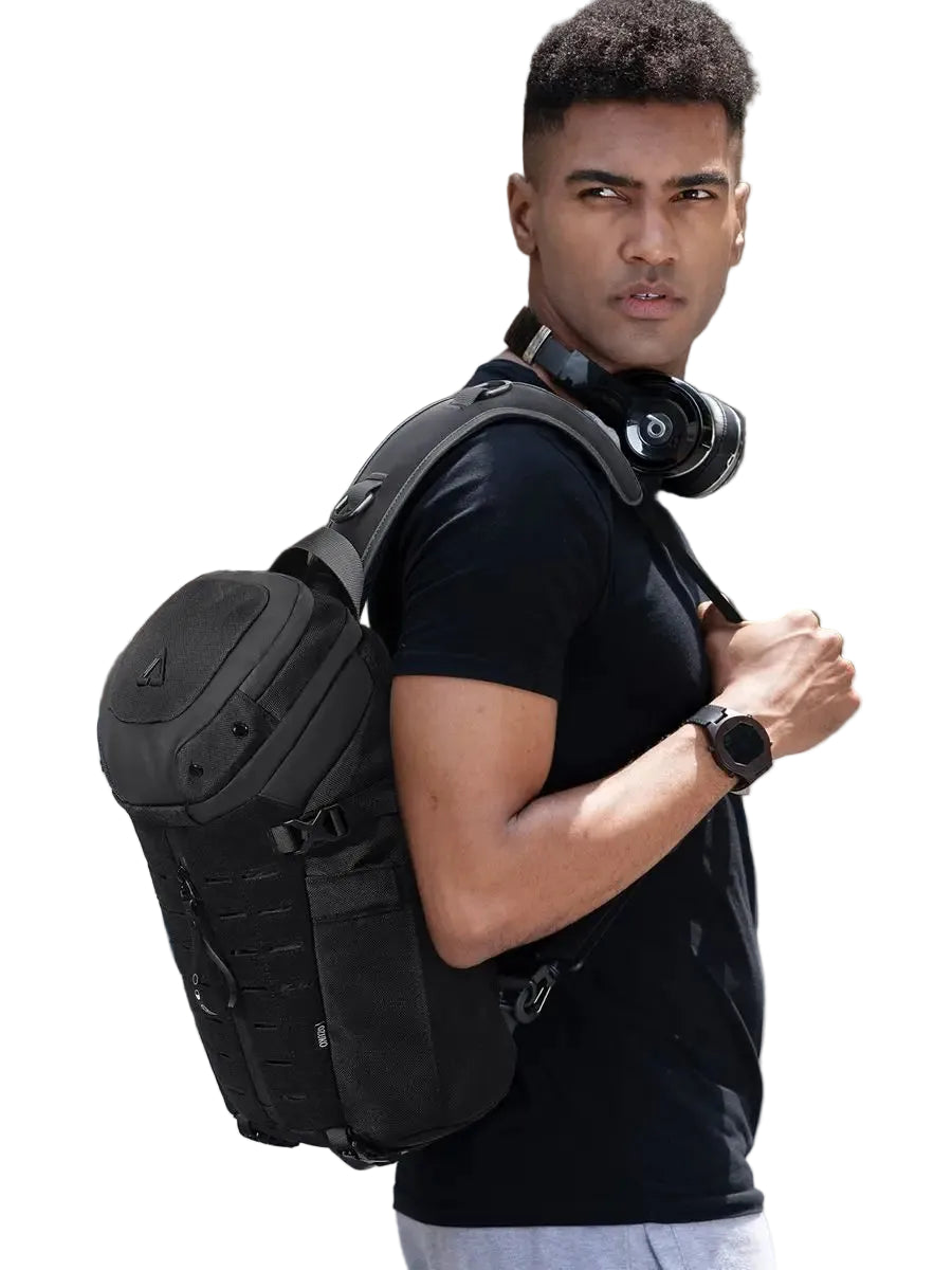 A man carrying a Stylish Men’s Chest Bag Anti-Theft Waterproof USB Sling on his back on a white background