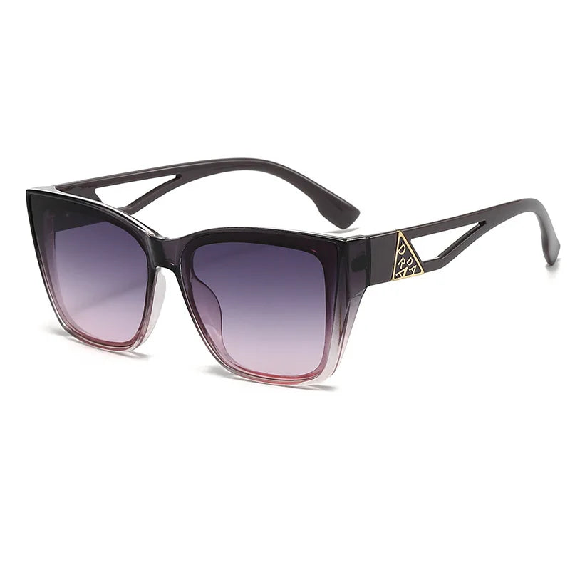 Sunglasses with a black frame and gradient lenses on a white background