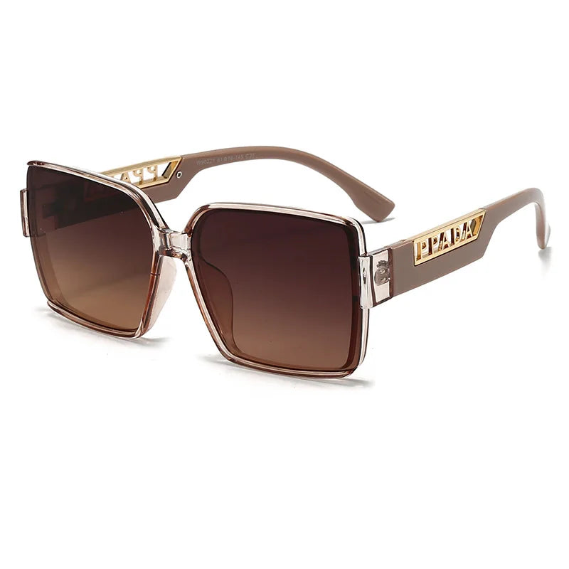 Sunglasses with gold frame and brown gradient lenses on a white background