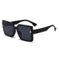 Black sunglasses with gold accents on a white background