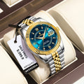 Trendy men’s waterproof watch with gold and silver steel band, blue dial, luminous hands, Roman numerals, date display, and luxury gift box presentation
