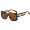 Sunglasses with tortoiseshell frame and brown lenses on a white background