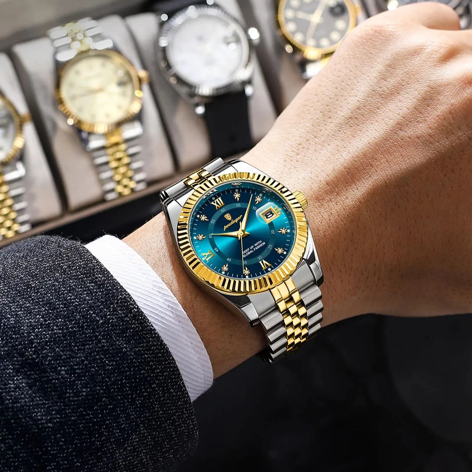 Versatile men’s waterproof watch with blue dial, luminous hands, date display, gold and silver stainless steel finish, worn with elegant formal outfit