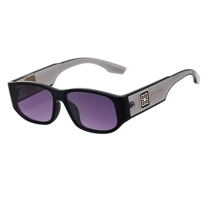 Black sunglasses with purple lenses on a white background
