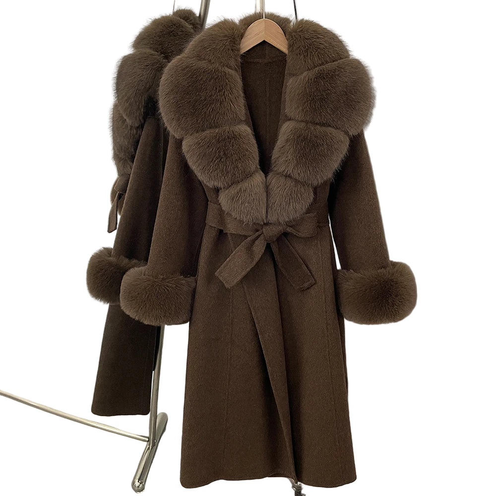 Brown coat with fur accents on a hanger against a white background