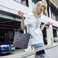 Woman with a chic luminous reflective bao Bag Geometric Tote on  her arm in a parking environment