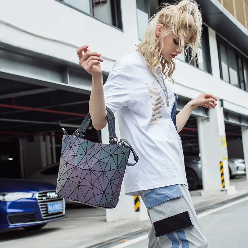 Woman with a chic luminous reflective bao Bag Geometric Tote on  her arm in a parking environment