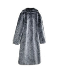 Gray fur coat hanging on a white wall with a gray chair in the background.