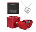 Heart-shaped silver necklace in a red box with a 'Love' card on a white background