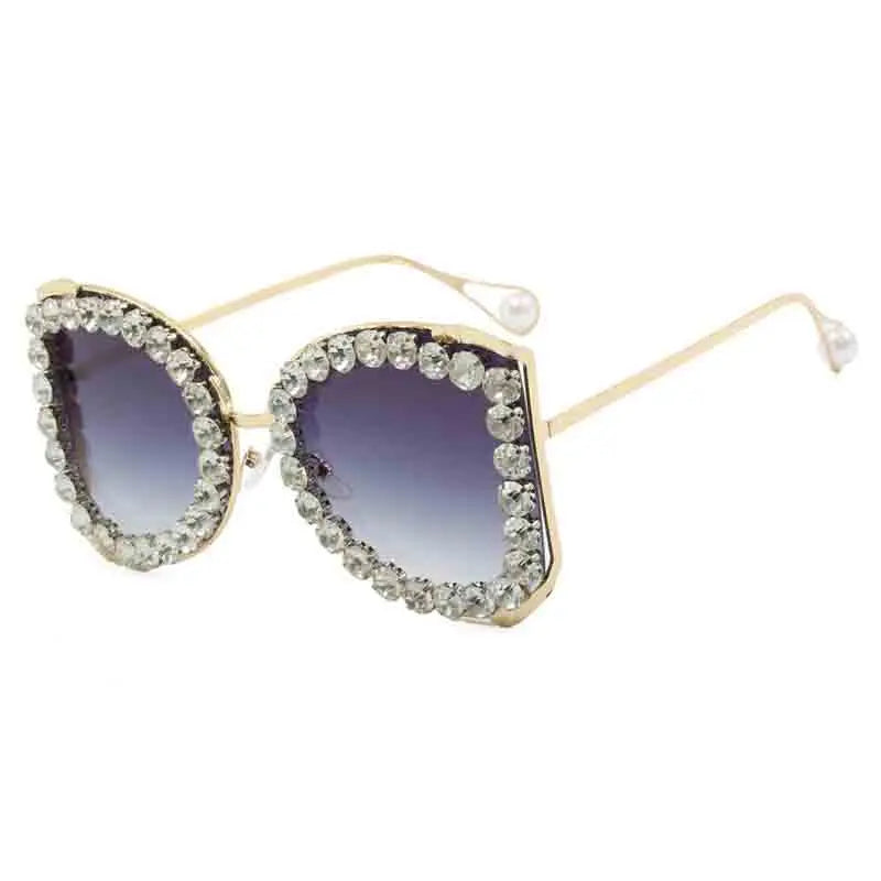 Sunglasses with decorative frame and gradient lenses on a white background
