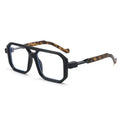 Eyeglasses with black frame and tortoiseshell accents on a white background