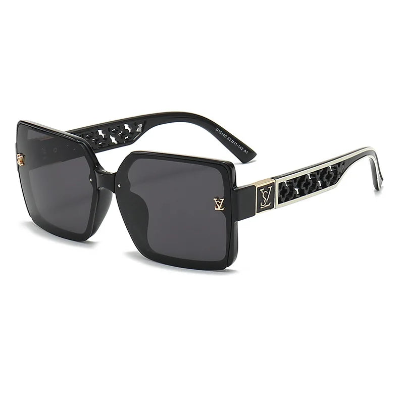 Black sunglasses with decorative frame on a white background