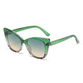 Green cat-eye sunglasses on a white background