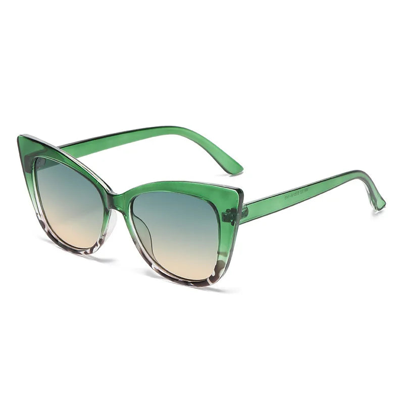 Green cat-eye sunglasses on a white background